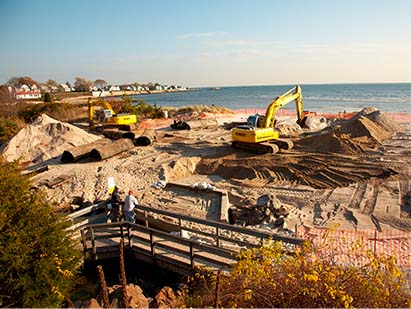 Photo of a large restoration project near the beach with backhoes and heavy equipment
