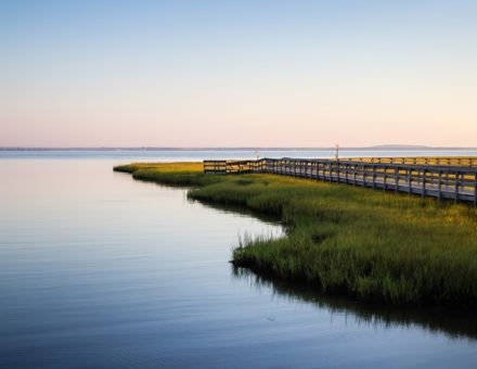 Estuary at sunset with dock
